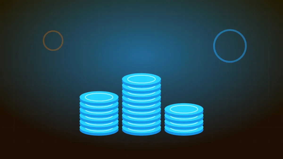 Pile di monete dorate che illustrano gli asset digitali e il risparmio