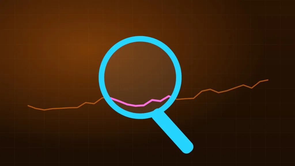 Magnifying glass over abstract charts and number columns on a desk
